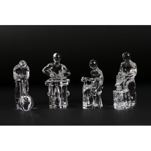 39 - Four Orrefors Swedish glass paperweights in the form of craftsmen, to include glassblower, blacksmit... 