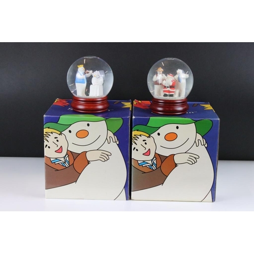 41 - Two Coalport 'The Snowman' snow globes to include 'At The Party' (no. 853 / 2000) and  Line Dancing.... 