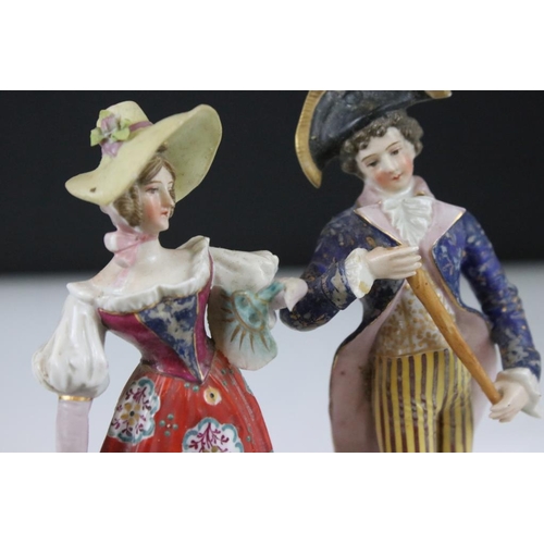 42 - Four 19th Century German porcelain figurines to include Sitzendorf promenading couple, Sitzendorf hu... 