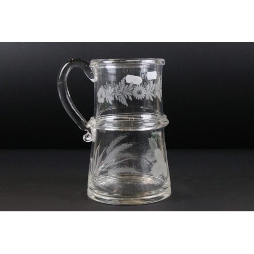 48 - Late Georgian glass tankard of two tier construction having etched floral, grape vine and wheat shea... 