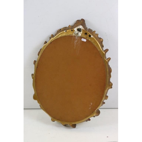 482 - 20th century Plaster Gilt Framed Oval Mirror in the Rococo style, 47cm x 62cm