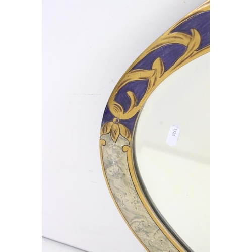 483 - Oval Bevelled edge Wall Mirror, the wooden framed partially painted with a swag of flowers on a blue... 