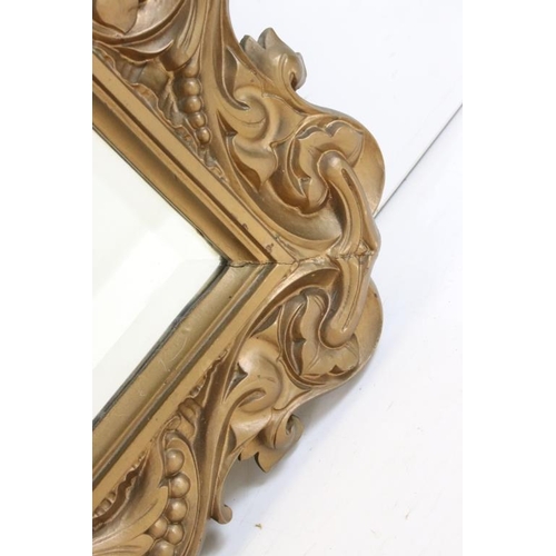 487 - 19th century style Bevelled Edge Wall Mirror with foliate scrolling gilt frame, 78cm x 61cm