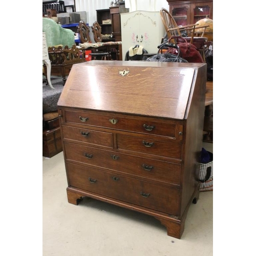 495 - George III Oak Bureau, the fall front opening to a fitted interior, over two short and three long dr... 