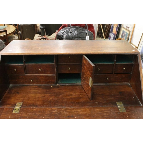 495 - George III Oak Bureau, the fall front opening to a fitted interior, over two short and three long dr... 