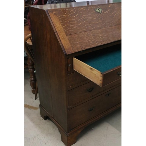 495 - George III Oak Bureau, the fall front opening to a fitted interior, over two short and three long dr... 