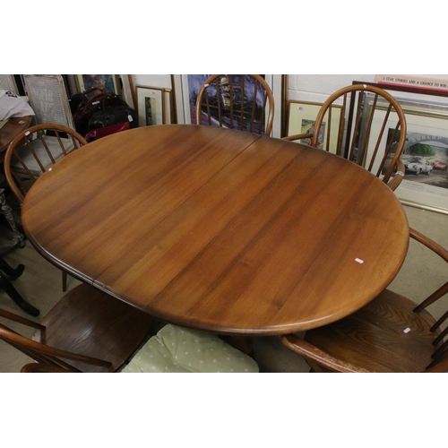 496 - Ercol Oval Extending Dining Table, 165cm long x 107cm wide x 75cm high together with a set of Six Er... 