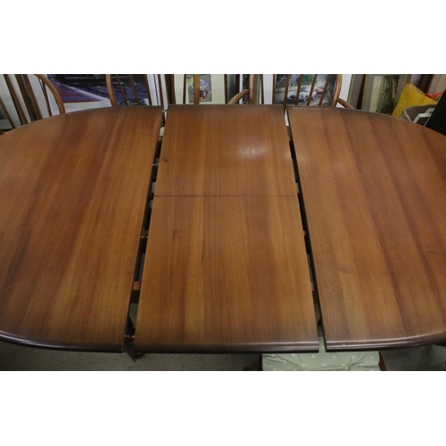 496 - Ercol Oval Extending Dining Table, 165cm long x 107cm wide x 75cm high together with a set of Six Er... 