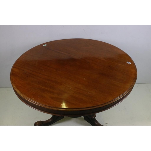 498 - Mid Victorian Mahogany Circular Tilt Top Loo Table, raised on carved centre column with three scroll... 