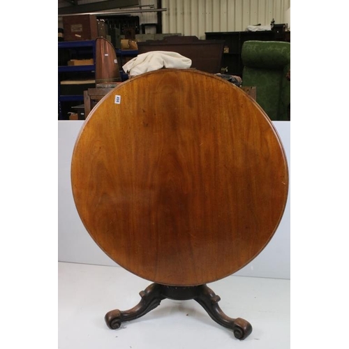 498 - Mid Victorian Mahogany Circular Tilt Top Loo Table, raised on carved centre column with three scroll... 