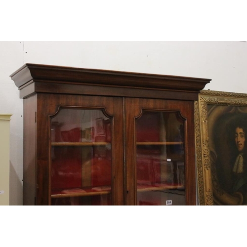 504 - 19th century Mahogany Bookcase Cupboard, the upper section with two glazed doors opening to three ad... 