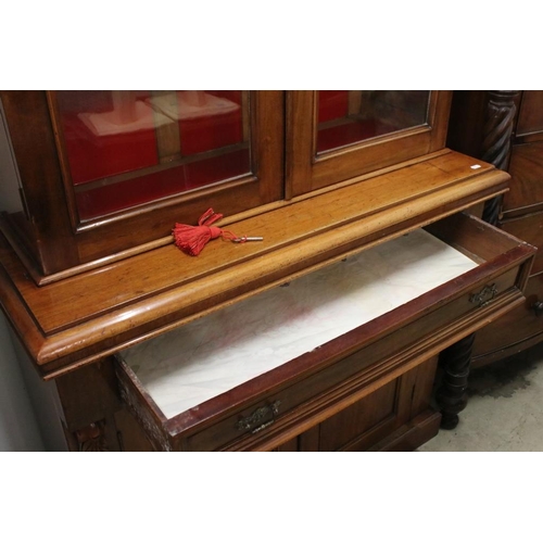 504 - 19th century Mahogany Bookcase Cupboard, the upper section with two glazed doors opening to three ad... 