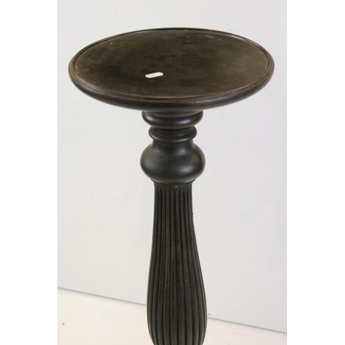 506 - Pair of 19th century Ebonised Jardiniere Stands, each with round tops over carved column supports an... 