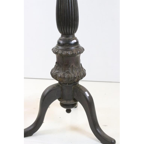 506 - Pair of 19th century Ebonised Jardiniere Stands, each with round tops over carved column supports an... 