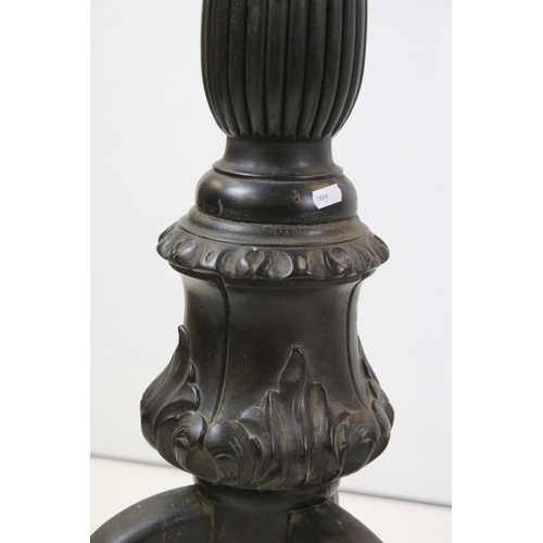 506 - Pair of 19th century Ebonised Jardiniere Stands, each with round tops over carved column supports an... 