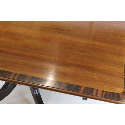 529 - Regency Mahogany and Rosewood Cross-banded Rectangular Tilt Top Supper Table raised on a turned pill... 