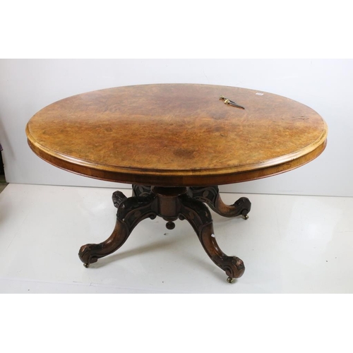 533 - Victorian Burr Walnut Oval Tilt Top Breakfast Table raised on turned bulbous pillar with four carved... 