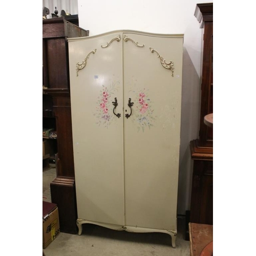 535 - Mid century French style Cream Wardrobe, the two panel doors with applied scroll decoration and hand... 