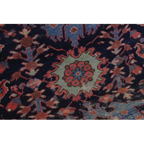 542 - Eastern Wool Blue ground Rug with stylised floral pattern within a border, 138cm x 192cm