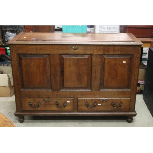 552 - 18th century Oak Mule Chest, the hinged lid above a three panel front with two drawers below, 126cm ... 