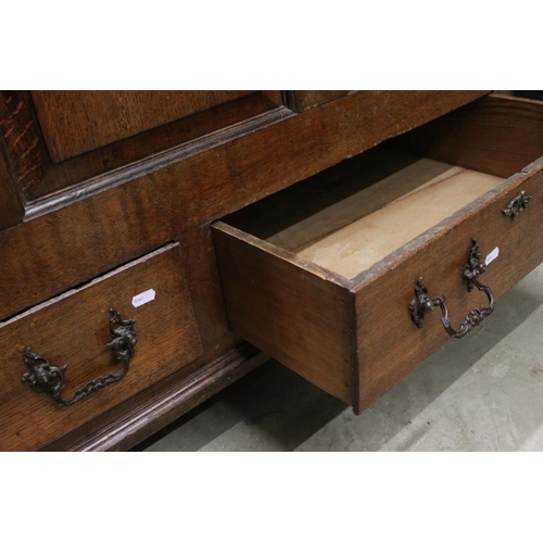 552 - 18th century Oak Mule Chest, the hinged lid above a three panel front with two drawers below, 126cm ... 