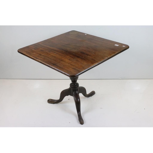 554 - George III Mahogany Square Tilt Top Supper Table raised on turned pillar support with three out-swep... 