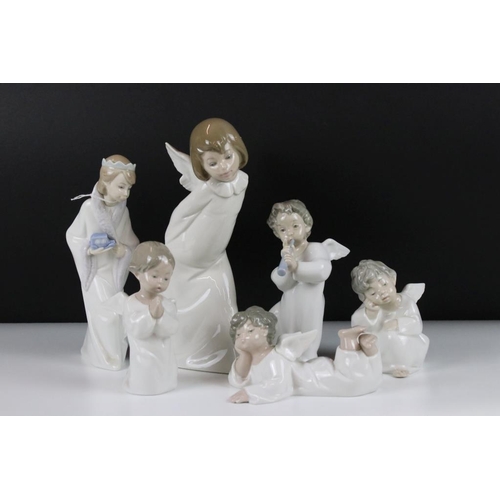 57 - Six Lladro figurines to include five figure with angel wings and one wearing a crown. Tallest measur... 