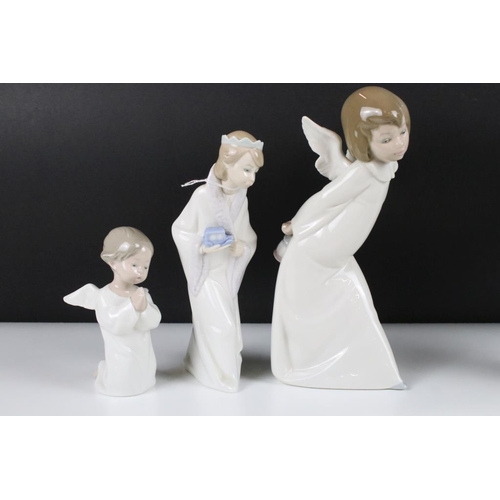 57 - Six Lladro figurines to include five figure with angel wings and one wearing a crown. Tallest measur... 