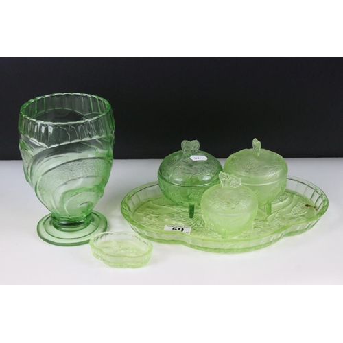 59 - Art Deco uranium green pressed glass dressing table set, together with a pressed glass vase. Vase me... 