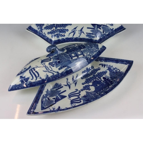 70 - Set of four 19th Century Victorian blue and white willow pattern lidded dishes, all moulded to fit t... 