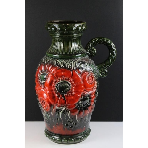 75 - Large West German pottery vase with moulded floral decoration on a green ground (54.5cm high), toget... 