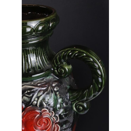 75 - Large West German pottery vase with moulded floral decoration on a green ground (54.5cm high), toget... 