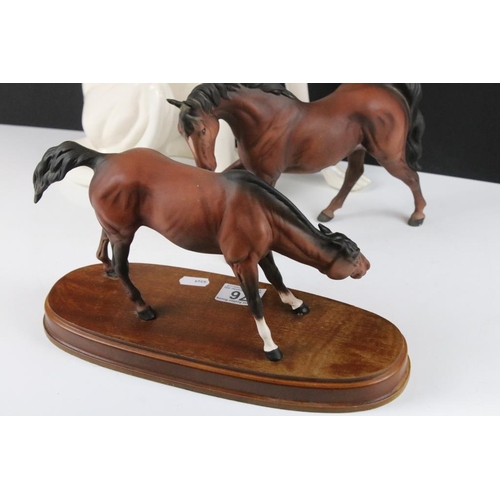 76 - Large ceramic figure of a seated Greyhound (50cm high), together with a Beswick matt brown horse mid... 