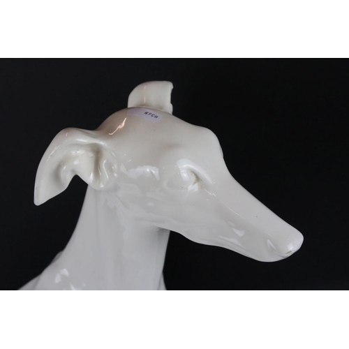 76 - Large ceramic figure of a seated Greyhound (50cm high), together with a Beswick matt brown horse mid... 