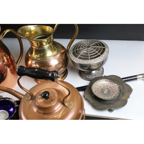 327 - Assorted metal wares to include a silver topped walking stick, copper kettle and jugs, coffee pot, t... 