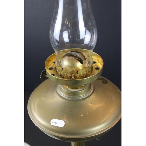 346 - 19th Century Victorian brass oil lamp having a reeded column base with white glass orb shade. Measur... 