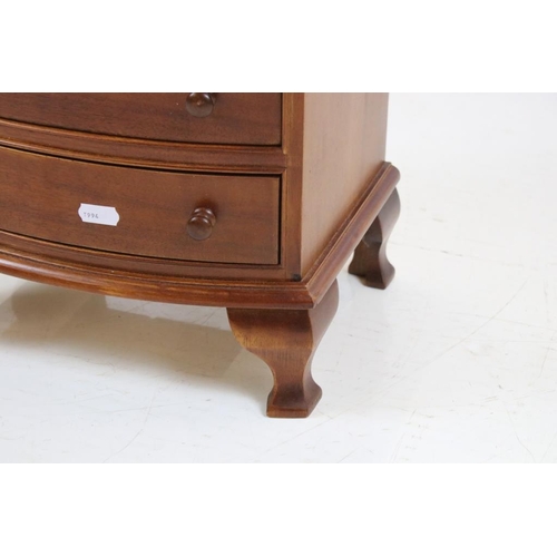 565 - Mahogany Table Top Cabinet in the form of a 19th century Bow Front Chest of Four Drawers, 30cm wide ... 