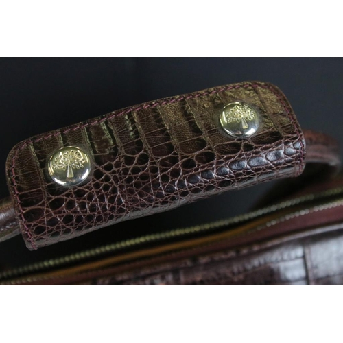 372 - Mulberry brown burgundy alligator skin embossed leather hold all bag. The bag with embossed tree log... 