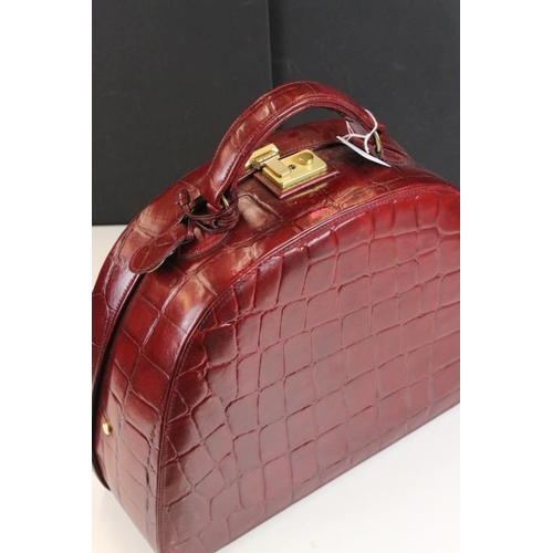 373 - Mulberry 'antique' leathers maroon beauty case bag, constructed from maroon red leather with alligat... 