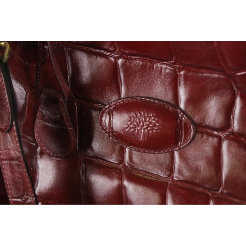 374 - Mulberry 'antique' leathers domed weekend holdall bag in maroon alligator embossed leather. The bag ... 