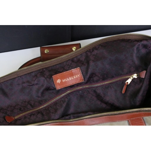 376 - Mulberry green canvas holdall weekend bag having brown leather banding and gold tone hardware with p... 