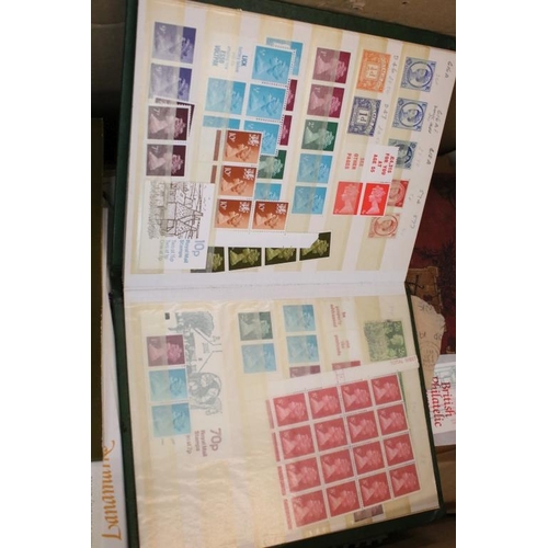 378 - Collection of stamps across two boxes to include assorted loose first day covers, presentation packs... 