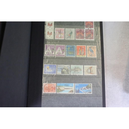 394 - Stamps and first day covers, three albums, to include British and Worldwide examples, a 1977 The Que... 