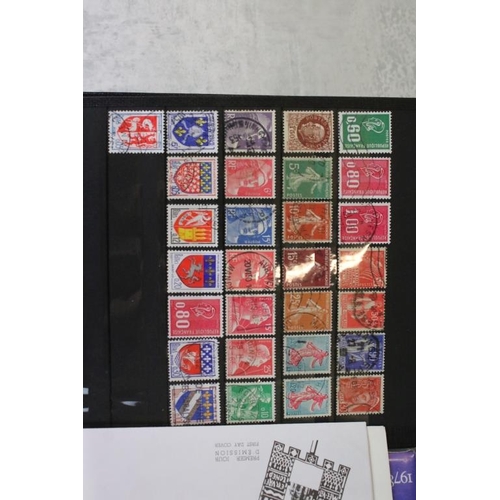 394 - Stamps and first day covers, three albums, to include British and Worldwide examples, a 1977 The Que... 