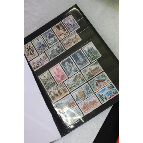 394 - Stamps and first day covers, three albums, to include British and Worldwide examples, a 1977 The Que... 