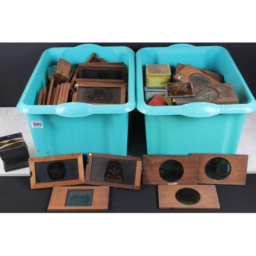 669 - Collection of around 150 glass magic lantern slides to include mahogany framed examples and boxed st... 