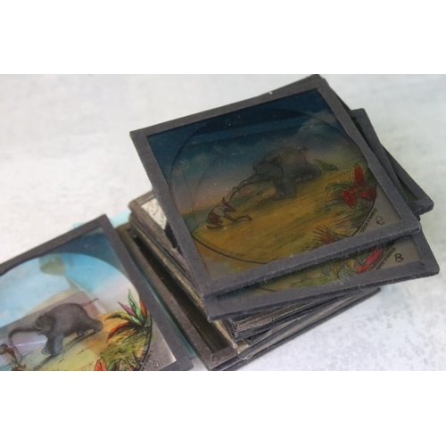 669 - Collection of around 150 glass magic lantern slides to include mahogany framed examples and boxed st... 