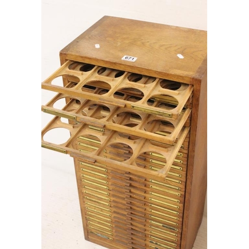 671 - Early 20th century oak magic lantern slide cabinet with 56 drawers, each drawer generally with 12 sp... 