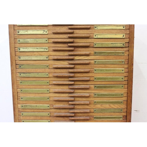 671 - Early 20th century oak magic lantern slide cabinet with 56 drawers, each drawer generally with 12 sp... 