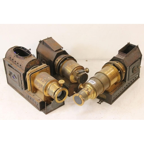 680 - Three late 19th century tinplate & gilt metal magic lantern projectors to include two Riley Bros of ... 